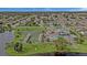 Aerial view of community with pool, tennis courts, and shuffleboard at 652 Linden Dr, Englewood, FL 34223