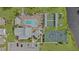 Aerial view of community amenities including pool, tennis, and shuffleboard courts at 652 Linden Dr, Englewood, FL 34223