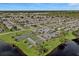 Aerial view showing community amenities including pool and tennis courts at 652 Linden Dr, Englewood, FL 34223