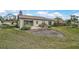 Spacious backyard with a large grassy area at 652 Linden Dr, Englewood, FL 34223