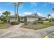 Community clubhouse with landscaping and flag at 652 Linden Dr, Englewood, FL 34223