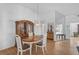 Dining room with hardwood floors, a wooden hutch, and an oval dining table at 652 Linden Dr, Englewood, FL 34223