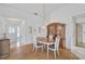 Dining area adjacent to the entryway, featuring a wood hutch and table at 652 Linden Dr, Englewood, FL 34223