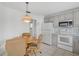 Cozy kitchen with light gray cabinets and a breakfast nook at 652 Linden Dr, Englewood, FL 34223