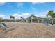 Community pool with lounge chairs and brick patio at 652 Linden Dr, Englewood, FL 34223