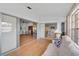 Bright sunroom features sliding glass doors leading to the living and kitchen areas at 652 Linden Dr, Englewood, FL 34223