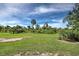 Spacious backyard with lush greenery at 6796 Gasparilla Pines Blvd # 13, Englewood, FL 34224