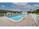 Inviting community pool with ample deck space at 6796 Gasparilla Pines Blvd # 13, Englewood, FL 34224