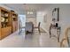 Dining area with wood cabinet and glass-top table at 6796 Gasparilla Pines Blvd # 13, Englewood, FL 34224