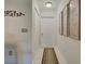 Bright entryway with tiled floor and coat closet at 6796 Gasparilla Pines Blvd # 13, Englewood, FL 34224
