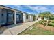 Front entrance of the property with walkway at 6796 Gasparilla Pines Blvd # 13, Englewood, FL 34224