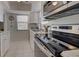 Modern kitchen with stainless steel appliances and granite countertops at 6796 Gasparilla Pines Blvd # 13, Englewood, FL 34224