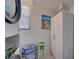 Laundry room with washer, dryer, and storage cabinet at 6796 Gasparilla Pines Blvd # 13, Englewood, FL 34224