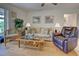 Living room with hardwood floors and comfortable seating at 6796 Gasparilla Pines Blvd # 13, Englewood, FL 34224