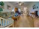 Spacious living room with hardwood floors and ample natural light at 6796 Gasparilla Pines Blvd # 13, Englewood, FL 34224