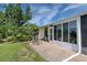 Brick paved patio with seating and grill at 6796 Gasparilla Pines Blvd # 13, Englewood, FL 34224