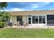 Outdoor patio with seating area and grill at 6796 Gasparilla Pines Blvd # 13, Englewood, FL 34224