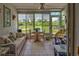 Sunroom with view of backyard and seating area at 6796 Gasparilla Pines Blvd # 13, Englewood, FL 34224