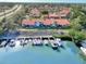 Aerial view of condo building with private boat docks at 738 Sorrento Inlt # 738, Nokomis, FL 34275