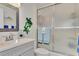 Bathroom with shower, sink, and decorative accents at 738 Sorrento Inlt # 738, Nokomis, FL 34275