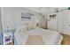 Cozy bedroom with full-size bed and beach decor at 738 Sorrento Inlt # 738, Nokomis, FL 34275