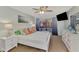 Bright bedroom with a king-size bed, balcony access, and plenty of light at 738 Sorrento Inlt # 738, Nokomis, FL 34275