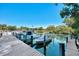 Wooden boat dock with several boats moored alongside at 738 Sorrento Inlt # 738, Nokomis, FL 34275