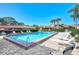 Relaxing community pool with lounge chairs at 738 Sorrento Inlt # 738, Nokomis, FL 34275