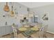 Bright dining room with glass table and coastal decor at 738 Sorrento Inlt # 738, Nokomis, FL 34275