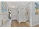 Entry hall with coat rack, bench and powder room at 738 Sorrento Inlt # 738, Nokomis, FL 34275