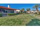 Landscaped grounds with walkway and building view at 738 Sorrento Inlt # 738, Nokomis, FL 34275