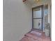 Front entrance with a gray door and welcoming mat at 738 Sorrento Inlt # 738, Nokomis, FL 34275