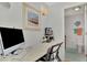 Home office with desk, computer, and adjacent bathroom at 738 Sorrento Inlt # 738, Nokomis, FL 34275