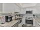 White shaker cabinets and granite countertops at 738 Sorrento Inlt # 738, Nokomis, FL 34275