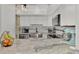Modern white kitchen with granite countertops at 738 Sorrento Inlt # 738, Nokomis, FL 34275