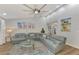 Comfortable living room with sectional sofa and large TV at 738 Sorrento Inlt # 738, Nokomis, FL 34275