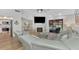 Spacious living room with sectional sofa and fireplace at 738 Sorrento Inlt # 738, Nokomis, FL 34275