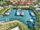 Aerial view of a marina with many boats docked at 738 Sorrento Inlt # 738, Nokomis, FL 34275