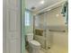 Bathroom with shower/tub combo and a small window at 817 Montrose Dr # 103, Venice, FL 34293