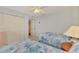 Bedroom with two twin beds and built in closet at 817 Montrose Dr # 103, Venice, FL 34293