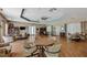 Community room with tables, chairs, and a kitchenette at 817 Montrose Dr # 103, Venice, FL 34293