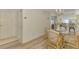 Dining area with glass table and wicker chairs at 817 Montrose Dr # 103, Venice, FL 34293