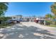 Front view of condo building with parking and landscaping at 817 Montrose Dr # 103, Venice, FL 34293