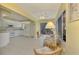 Open concept kitchen with sunroom and white cabinets at 817 Montrose Dr # 103, Venice, FL 34293