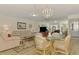 Living room with beige couch and red recliner at 817 Montrose Dr # 103, Venice, FL 34293