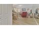 Living room with light flooring and wicker dining set at 817 Montrose Dr # 103, Venice, FL 34293