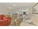 Spacious living room with comfortable seating and adjacent dining area at 817 Montrose Dr # 103, Venice, FL 34293