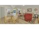 Open living and dining area with light flooring at 817 Montrose Dr # 103, Venice, FL 34293