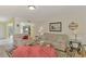Bright living room with comfy seating and large windows at 817 Montrose Dr # 103, Venice, FL 34293