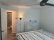 Bright bedroom view to a tiled shower with glass doors, and a modern dresser at 874 Baveno Dr, Venice, FL 34285